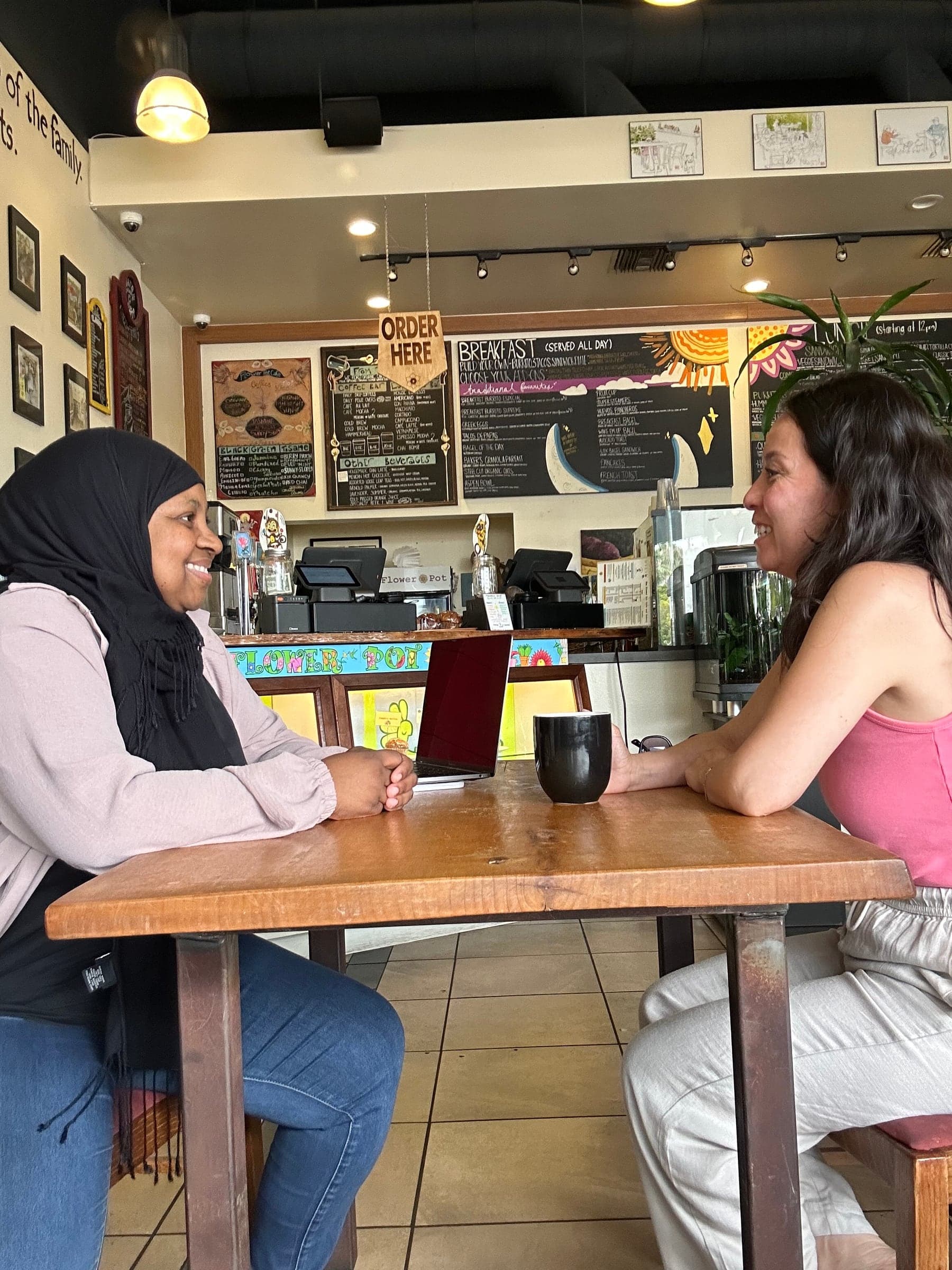 Ruqayyah in conversation during a private diagnostics meeting.