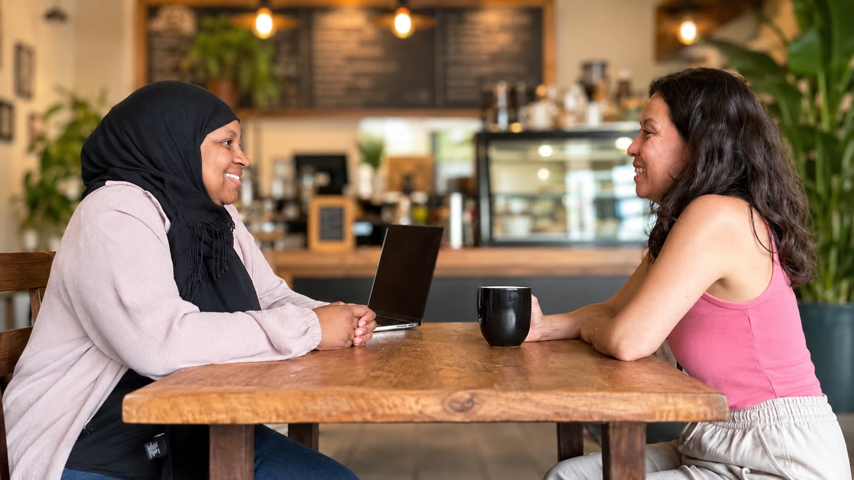 Ruqayyah in conversation during a private diagnostics meeting.